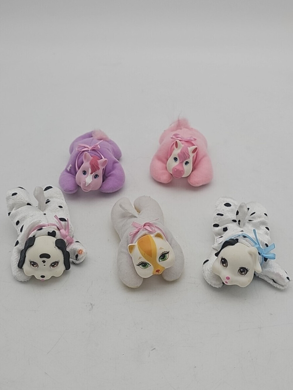 Lot of 5 vintage Surprise Babies plush toys. Includes puppies, ponies, kitty.